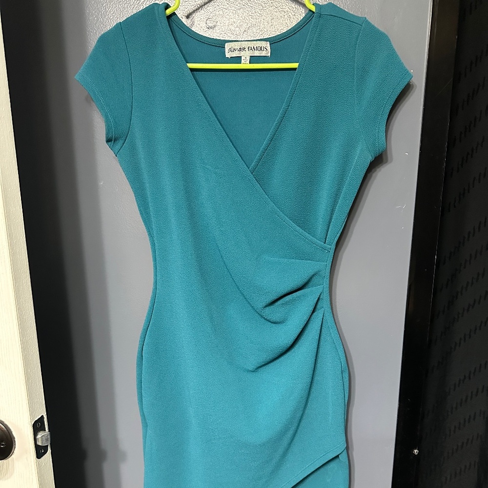Lightly worn teal body con dress